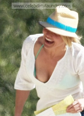 Actress Cameron Diaz has a nipple slip as she runs through the sand on the