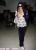 Paris Hilton Arrives At LAX From France & Gets Mobbed By Photographers