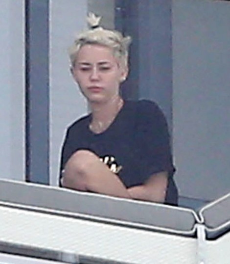 Miley Cyrus Smokes Weed On Balcony, Trying To Be Jennifer Lawrence For Liam Hemsworth? (Photos) 0407