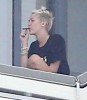 Miley Cyrus Smokes Weed On Balcony, Trying To Be Jennifer Lawrence For Liam Hemsworth? (Photos) 0407