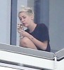 Miley Cyrus Smokes Weed On Balcony, Trying To Be Jennifer Lawrence For Liam Hemsworth? (Photos) 0407