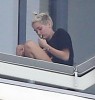 Miley Cyrus Smokes Weed On Balcony, Trying To Be Jennifer Lawrence For Liam Hemsworth? (Photos) 0407