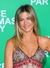 Jennifer Aniston Fuels Pregnancy Reports, Rubs Alleged Baby Bump During ‘Christmas Party’ Red Carpet Event