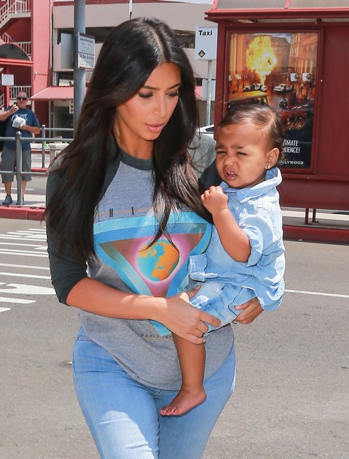 Kim Kardashian Holding North West in New Pics - Nori Looks Miserable (PHOTOS)