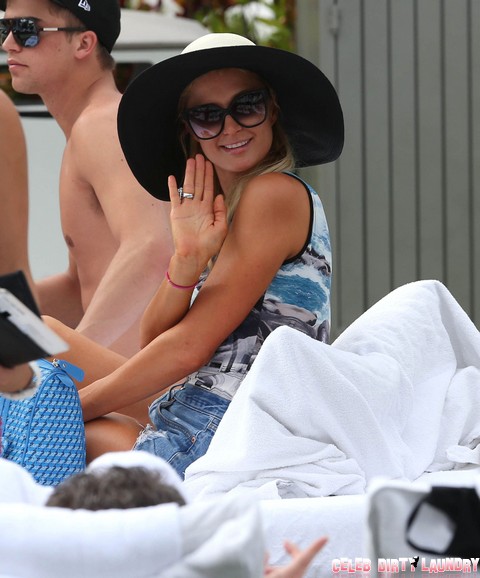 Paris Hilton Looks Amazing As She Relaxes Poolside In Miami (Photos)